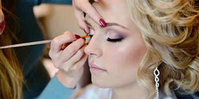 make-up artists applying makeup during a pandemic